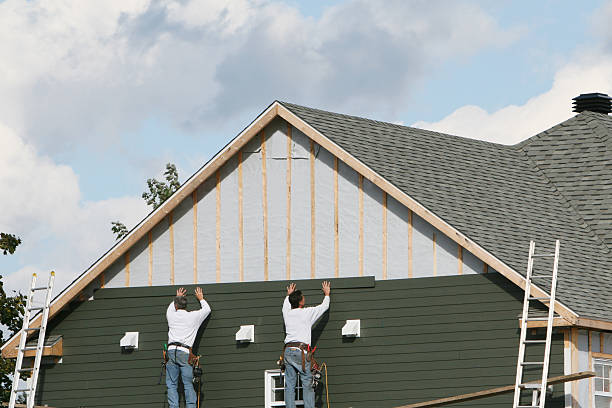 Professional Vinyl Siding technician working in Worcester, MA